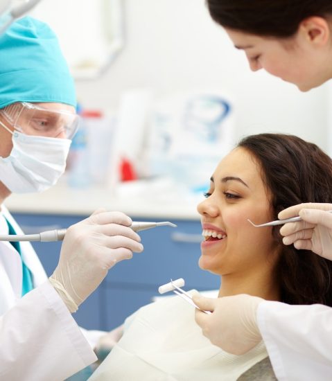 Dentist examining patient